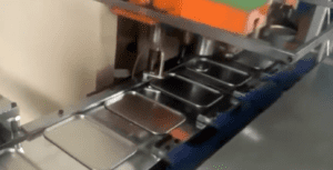 Rectangular top lid hole punching and neck riveting machine